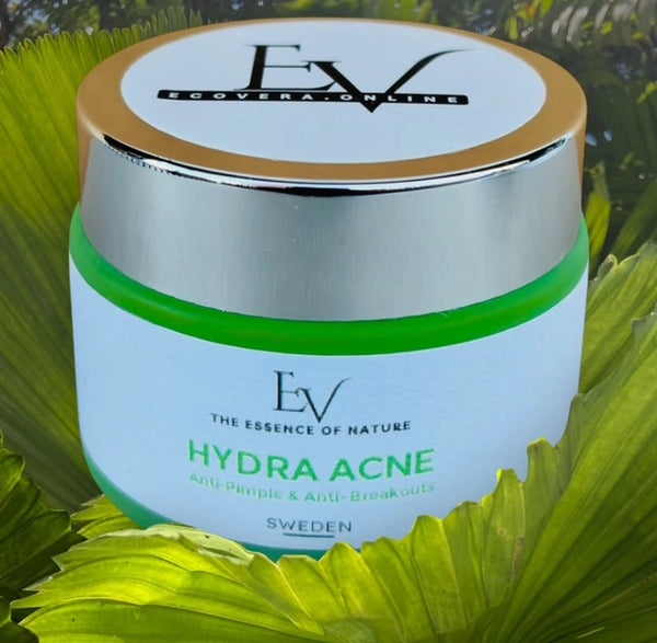  Hydra Acne Cream presented with lush greenery in the background, underlining its natural extracts like Tea Tree and Hemp Seed Oil that help combat acne and reduce inflammation.